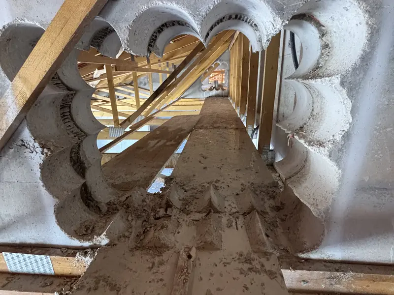 Ouverture créée par carottages jointifs dans un double voile béton sous charpente à Saint-Rémy-de-Provence
